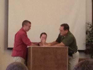 Karl, Sara, and Pastor Jerry at Sara's Baptism